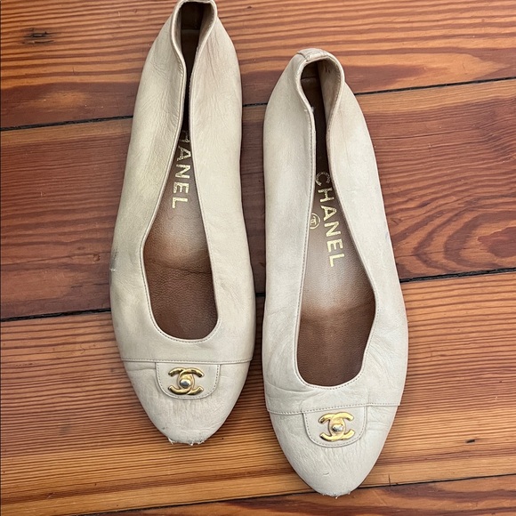 CHANEL Shoes - CHANEL Beige Leather Flats with Gold Logo